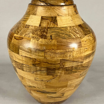 Turned wood urn made with Ambrosia segments